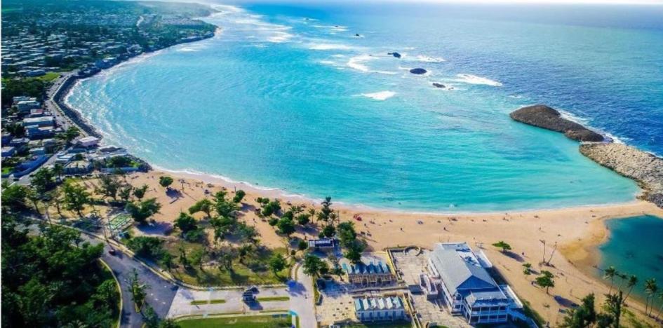 an aerial view of a beach and the ocean at Villahouse3 in Vega Baja
