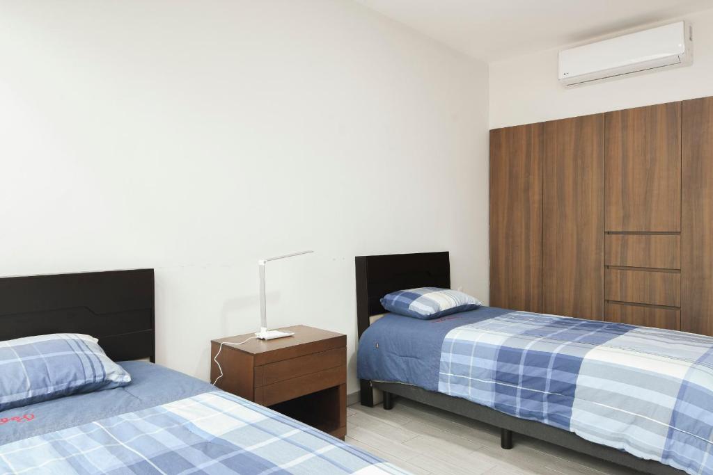 Postel nebo postele na pokoji v ubytování Departamento Punta Rio Cerca del Mar