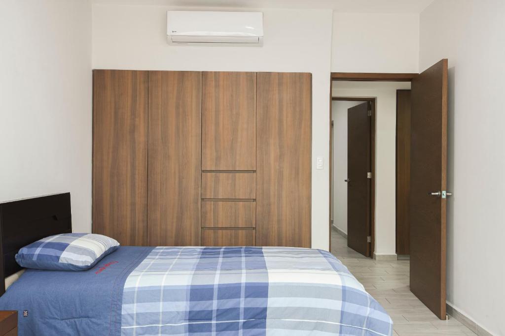 Postel nebo postele na pokoji v ubytování Departamento Punta Rio Cerca del Mar