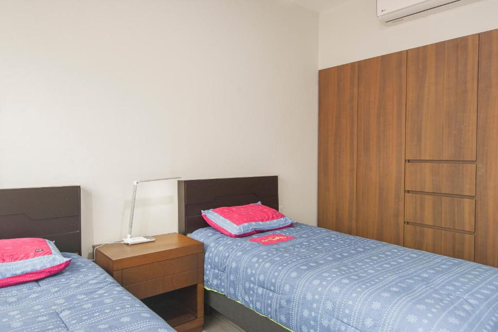 Postel nebo postele na pokoji v ubytování Departamento Punta Rio Cerca del Mar
