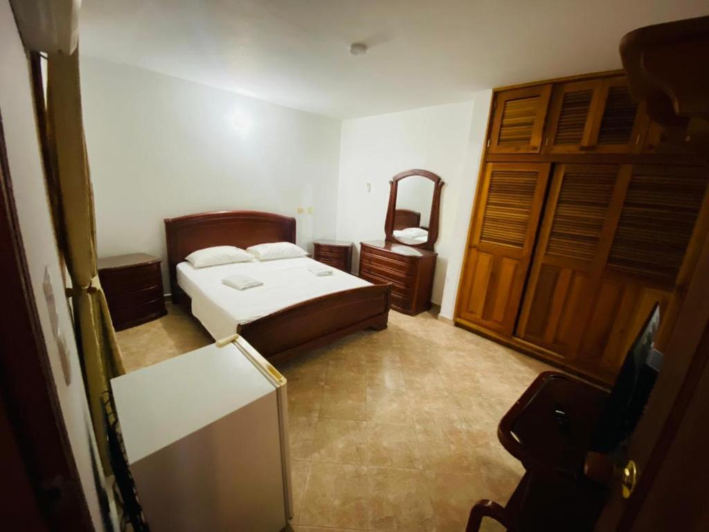 Postel nebo postele na pokoji v ubytování Hotel Tamarindo Resort