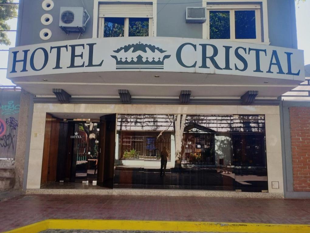 a hotel sign on the front of a building at Hotel Cristal in Mendoza
