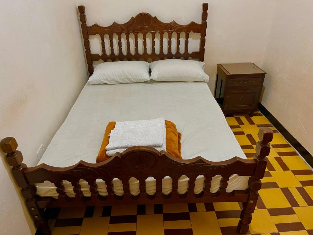 Postel nebo postele na pokoji v ubytování Casa Grande Hostal