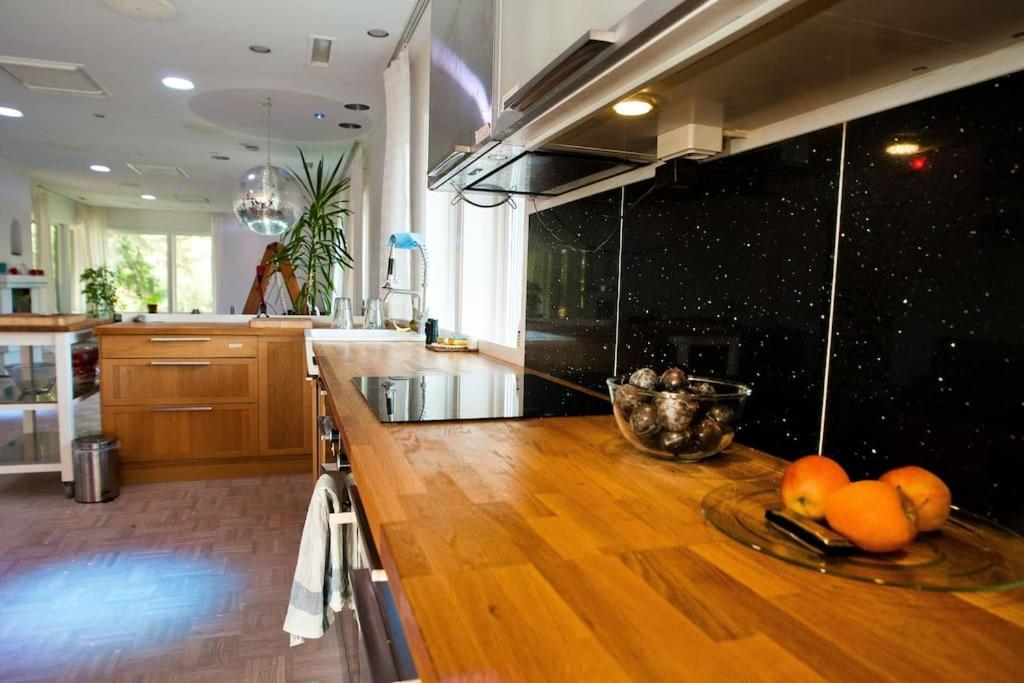 a kitchen with a counter with fruits on it at Villa Livslust Trollbäcken uthyrning pågår in Tyresö