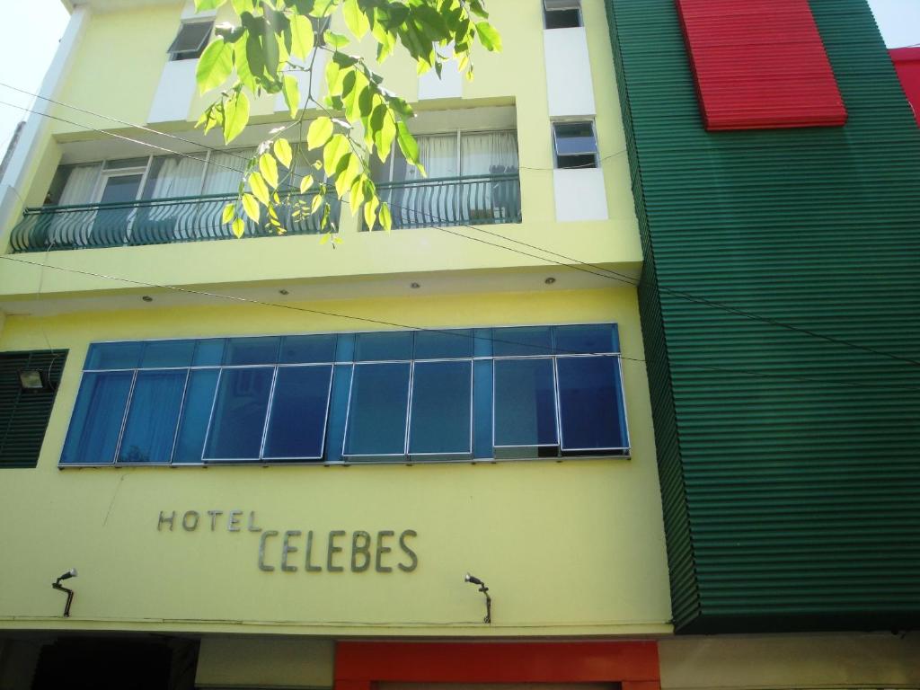 a building with a hotel caledictions sign on it at Hotel Celebes in Manado