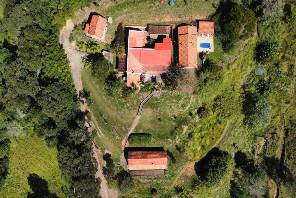 an aerial view of a house on a hill at Estância Village de Cunha in Cunha