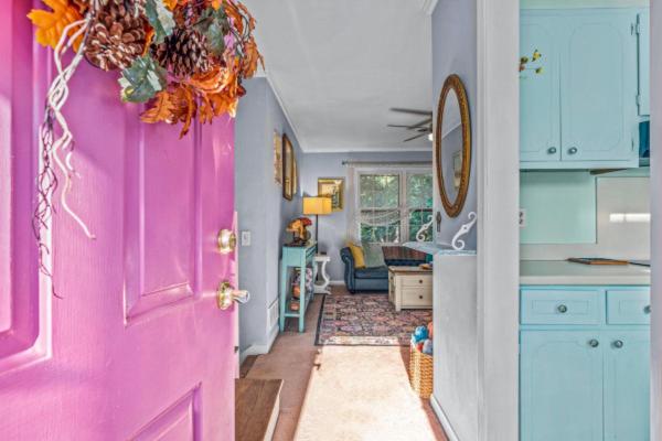 a pink door in a kitchen with a living room at Artsy Athens Oasis with spacious living area in Athens