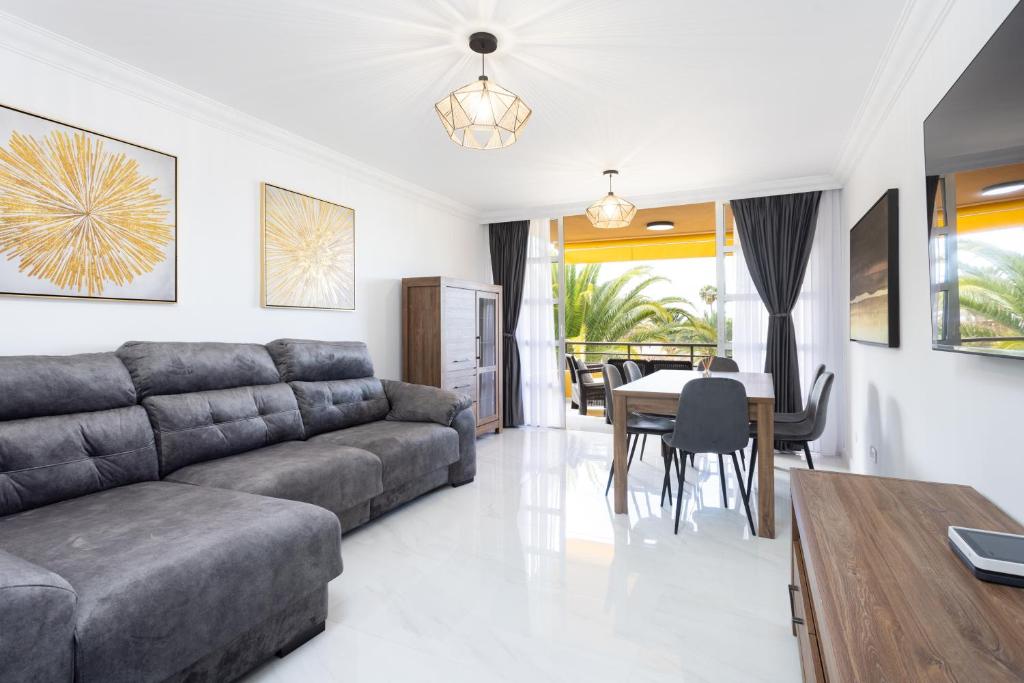 a living room with a couch and a table at Apartamento Clara in Los Cristianos