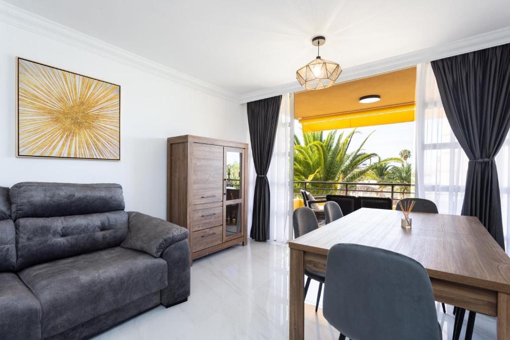 a living room with a couch and a table at Apartamento Clara in Los Cristianos