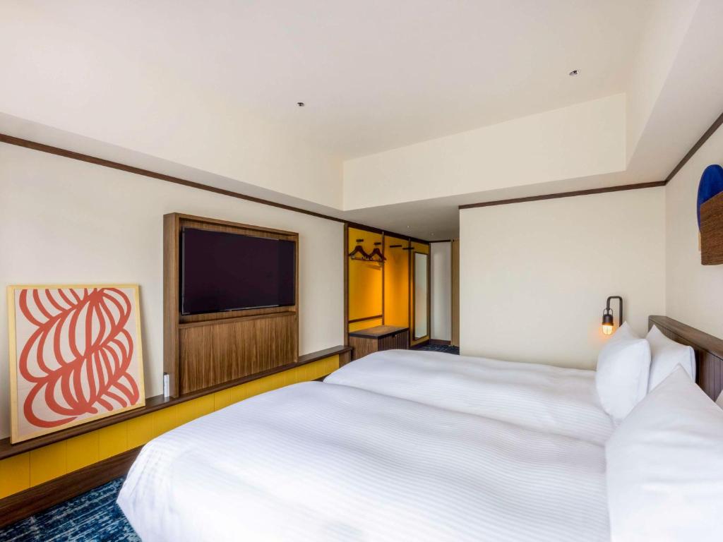 Postel nebo postele na pokoji v ubytování Mercure Hida Takayama