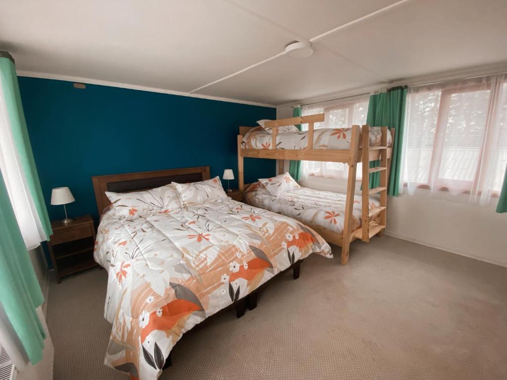Postel nebo postele na pokoji v ubytování Indomito Sur Hostel