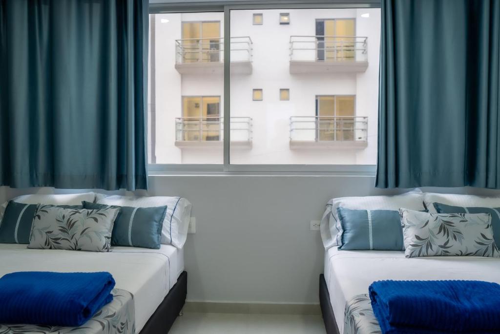 Postel nebo postele na pokoji v ubytování El Oscar Hotel