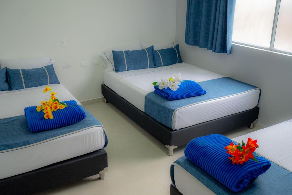 Postel nebo postele na pokoji v ubytování El Oscar Hotel