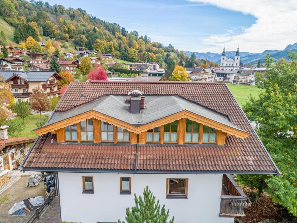 a house with a brown roof on top of it at Appartement Brixnerwirt IV in Brixen im Thale