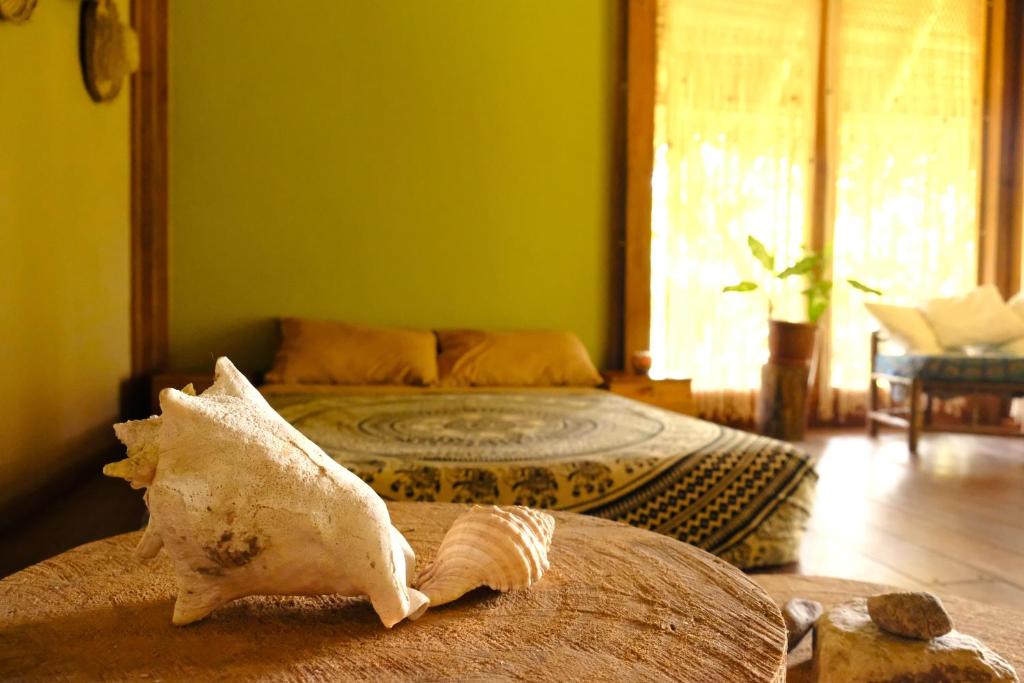 Postel nebo postele na pokoji v ubytování PUQIO ECOLODGE