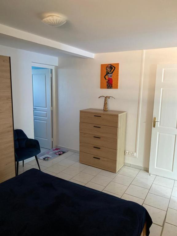 Postel nebo postele na pokoji v ubytování Le Cocon de l'Oranger