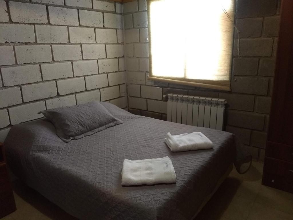 מיטה או מיטות בחדר ב-Los Duraznillos