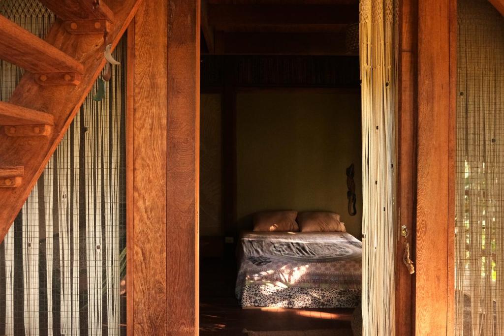 Postel nebo postele na pokoji v ubytování PUQIO ECOLODGE