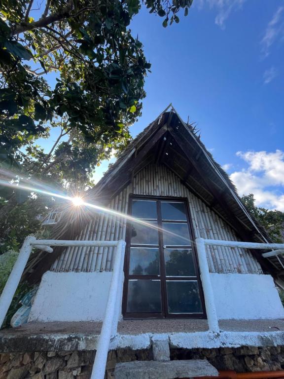 a house with a window on the front of it at Borac Bay View in Borac