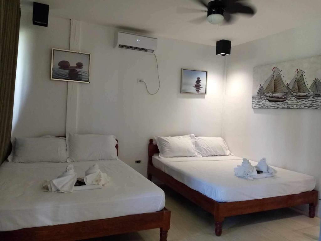 Postel nebo postele na pokoji v ubytování Villa Royal Palawan