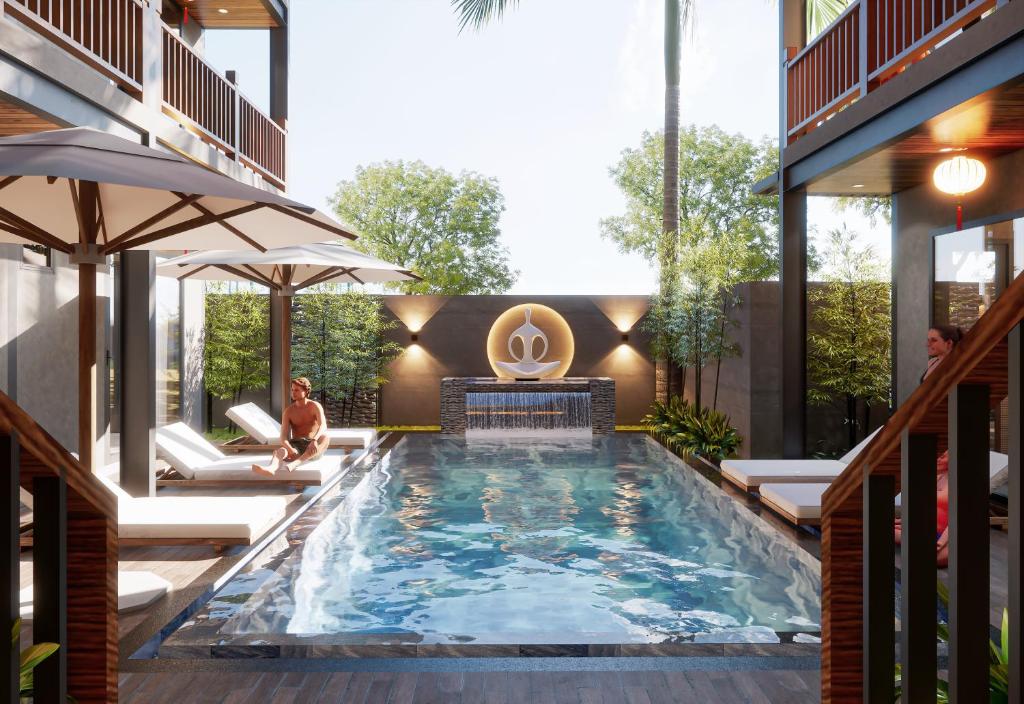 a swimming pool in the middle of a house at The Linh Seaside Villa Hoi An in Hoi An