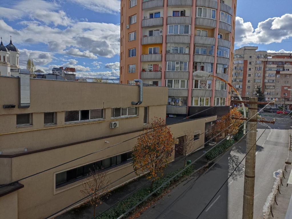 a view of a city street with tall buildings at Ame Farmec in Cluj-Napoca