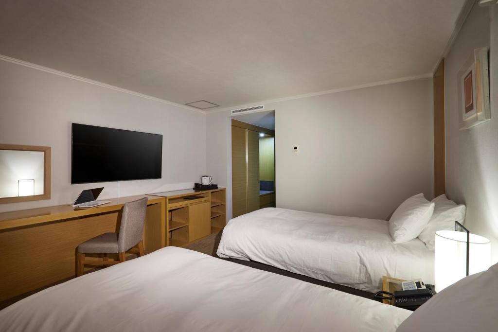 Postel nebo postele na pokoji v ubytování Hotel Interciti