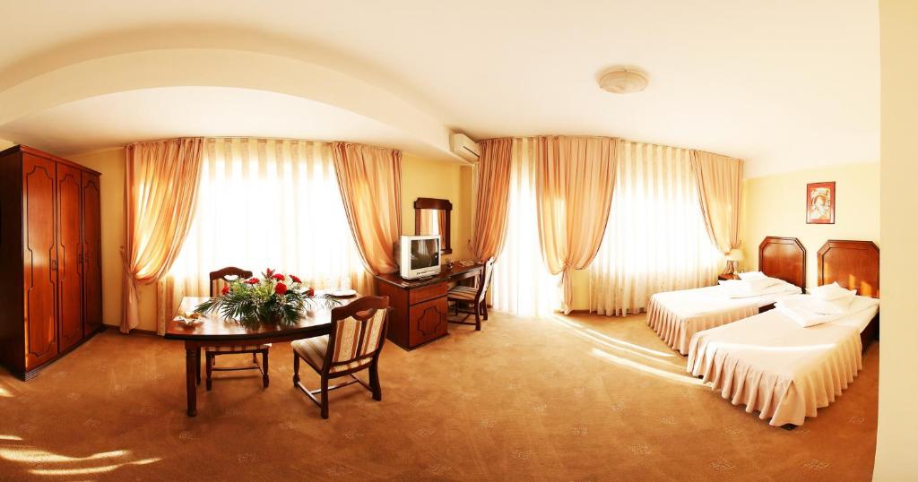 Postel nebo postele na pokoji v ubytování Hotel Premier