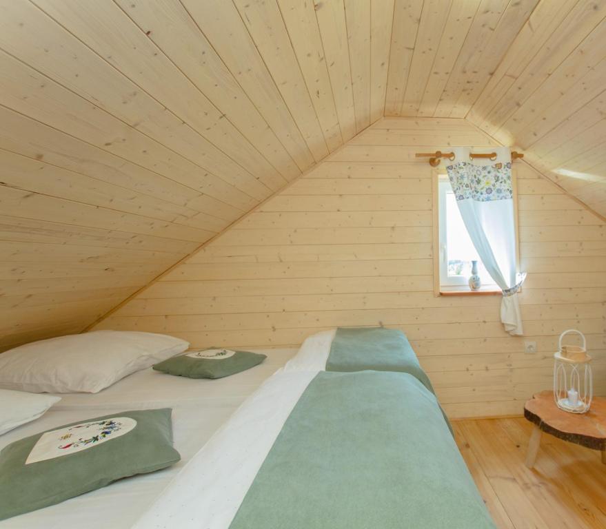 Postel nebo postele na pokoji v ubytování Kaszubskie Spa Ziółko