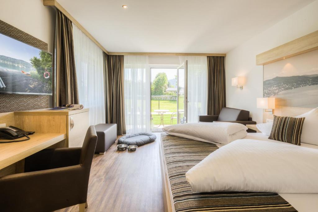 Postel nebo postele na pokoji v ubytování Seehotel Das JO