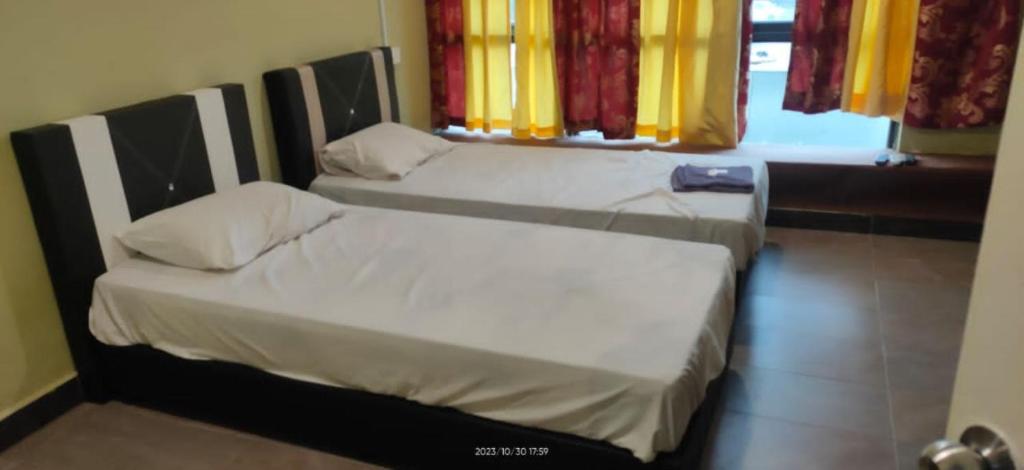 Postel nebo postele na pokoji v ubytování Hotel Lii View Labis