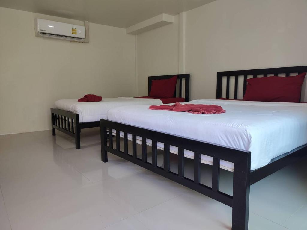 Postel nebo postele na pokoji v ubytování Kitty Guesthouse