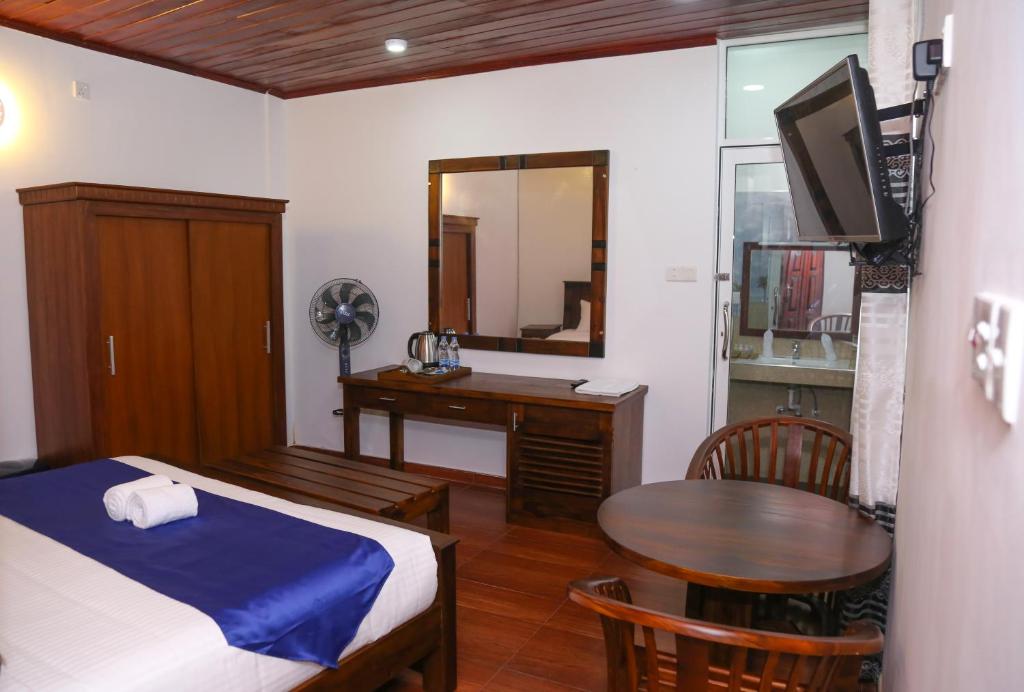 Postel nebo postele na pokoji v ubytování Hotel Sara