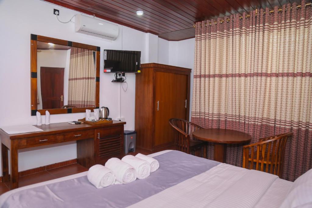 Postel nebo postele na pokoji v ubytování Hotel Sara