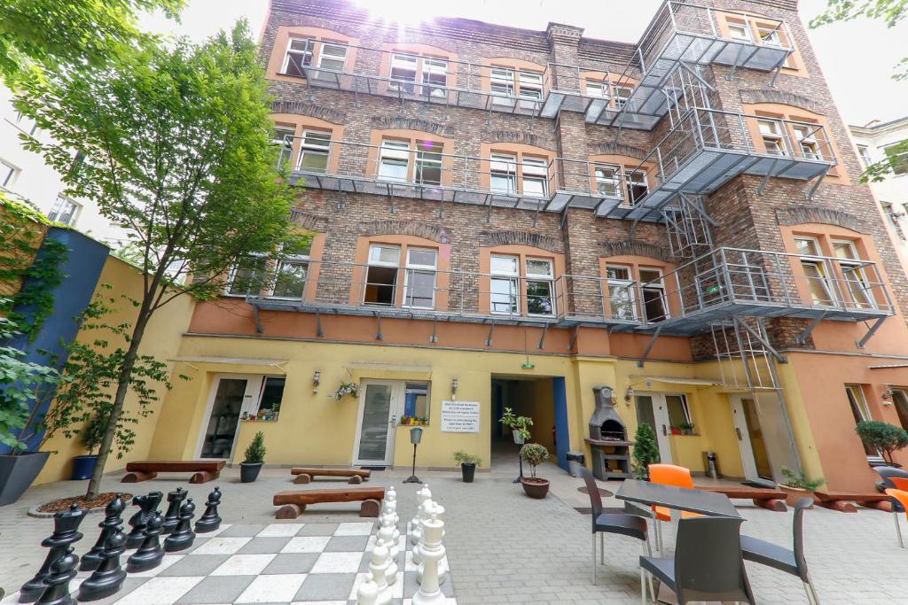 a building with a chess board in front of it at Do Step Inn Home - Hotel & Hostel in Vienna