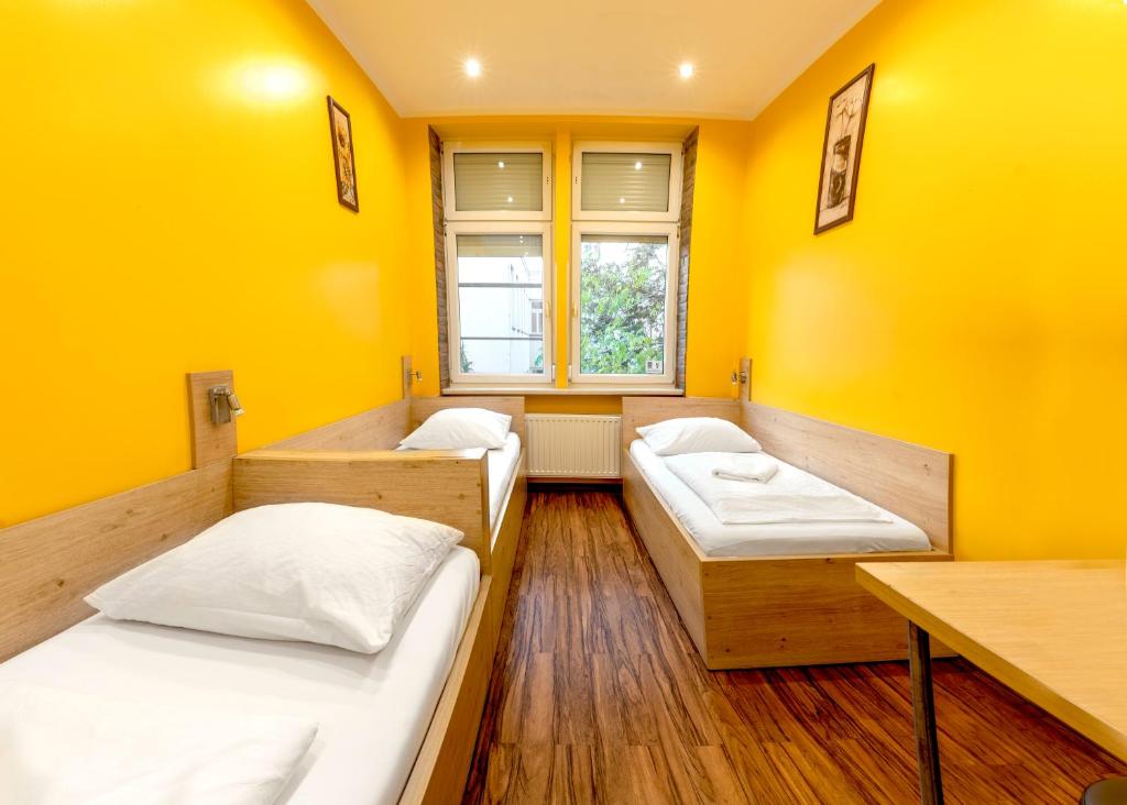 A bed or beds in a room at Do Step Inn Home - Hotel & Hostel