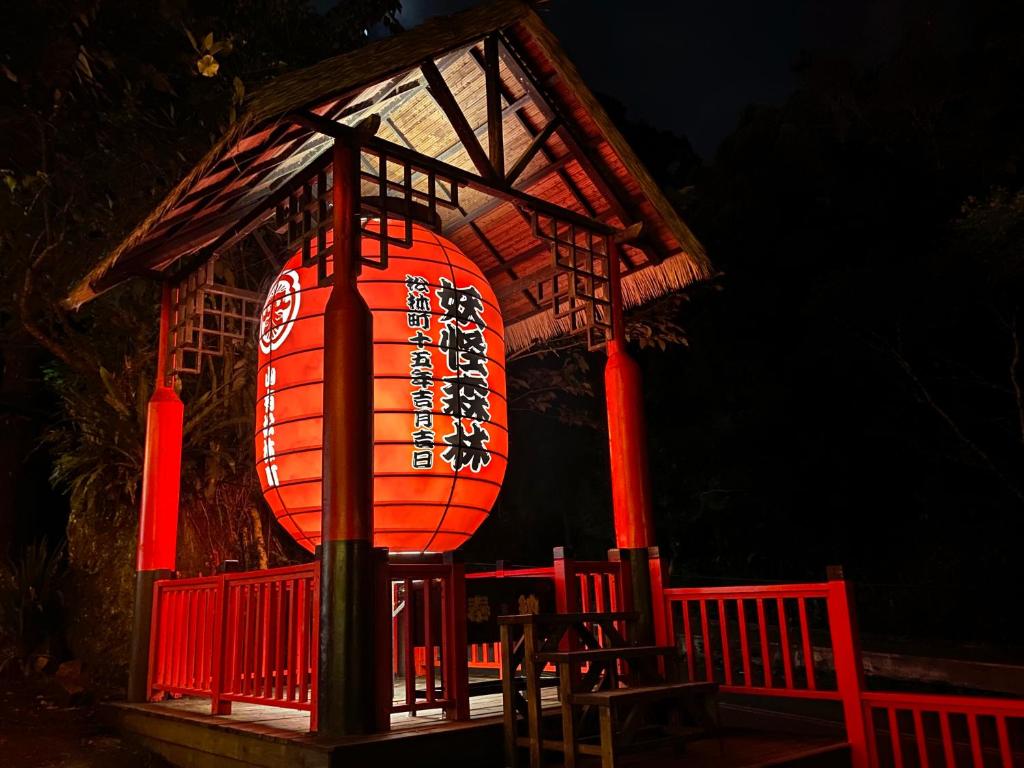 a building with a lantern on the front of it at 妖怪森林 The M Village in Lugu