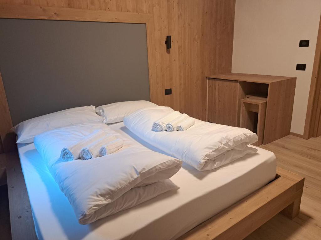 Postel nebo postele na pokoji v ubytování aMa Dolomiti