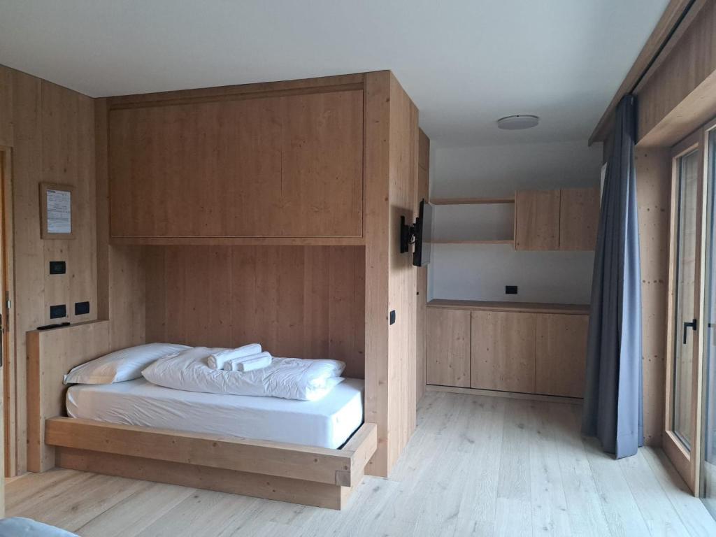 Postel nebo postele na pokoji v ubytování aMa Dolomiti