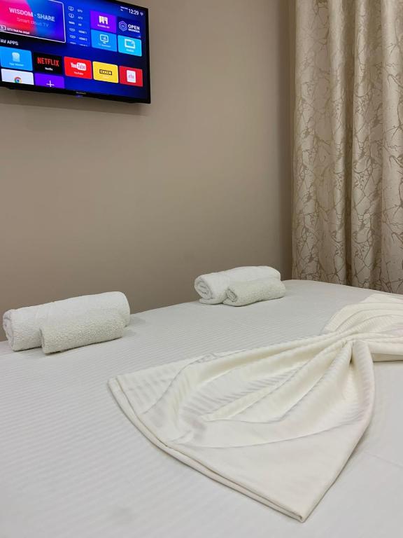 Postel nebo postele na pokoji v ubytování Vila Qyteza
