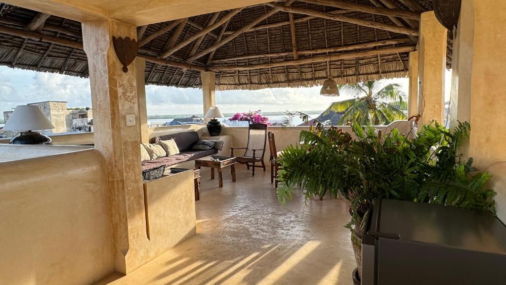 a living room with a view of the ocean at Ttunu House in Lamu