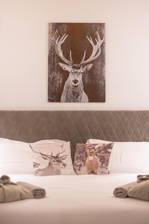 Postel nebo postele na pokoji v ubytování Hotel Villa Melì
