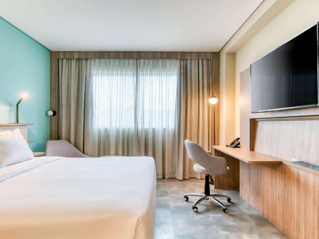 Cama ou camas em um quarto em Novotel BH Savassi