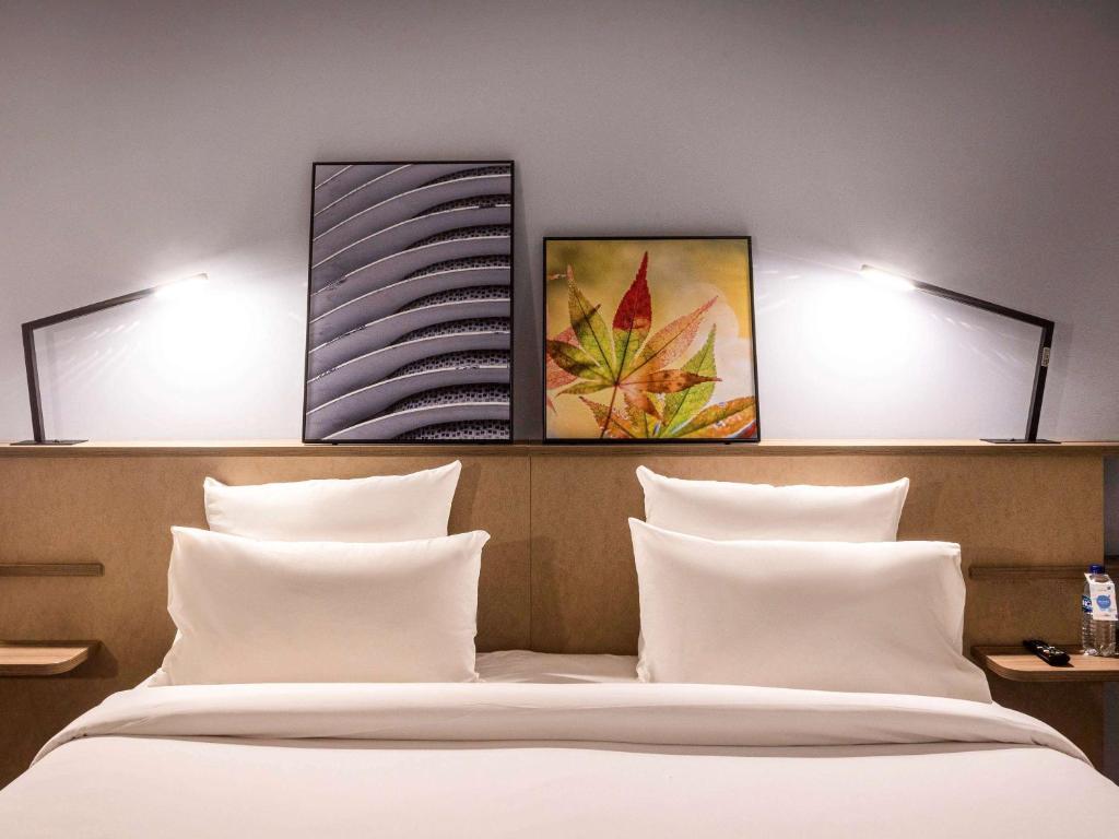Cama ou camas em um quarto em Novotel BH Savassi