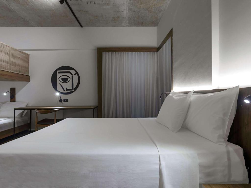 Postel nebo postele na pokoji v ubytování ibis Styles Maceió Pajuçara