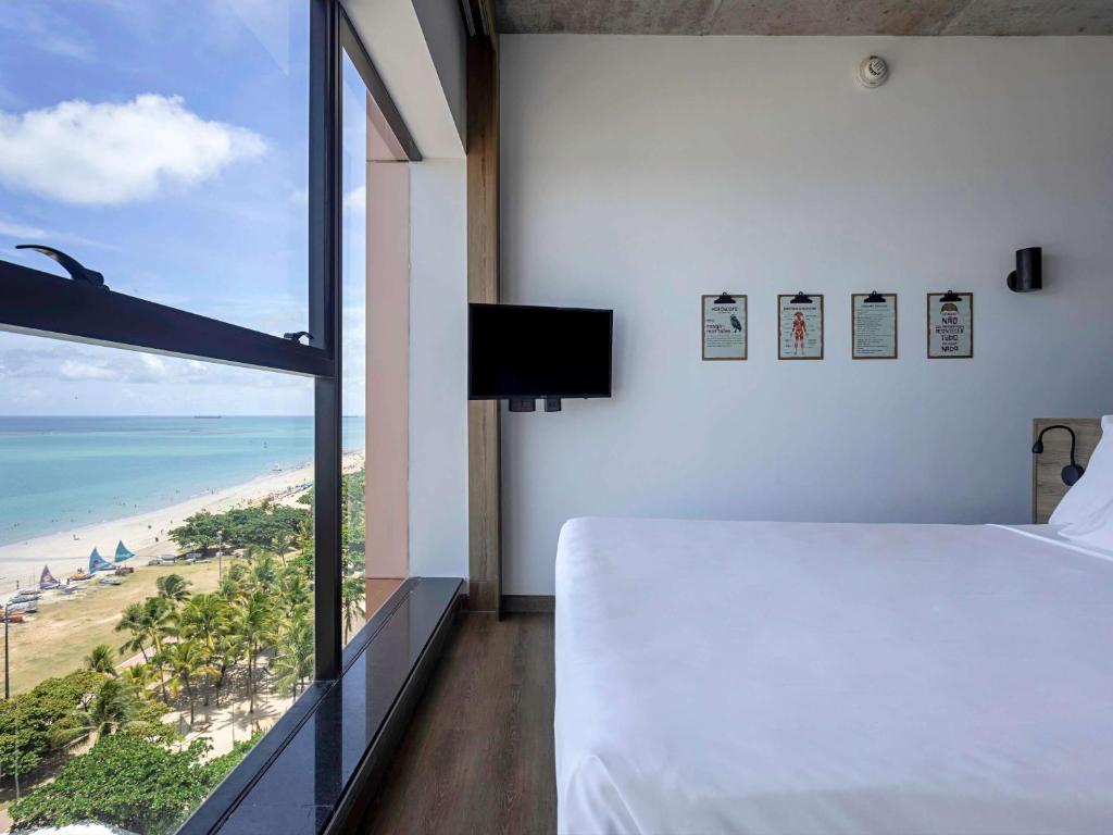 Postel nebo postele na pokoji v ubytování ibis Styles Maceió Pajuçara