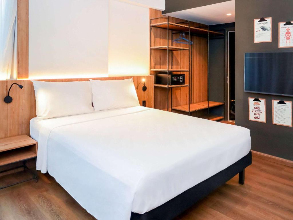 Postel nebo postele na pokoji v ubytování ibis Styles Maceió Pajuçara