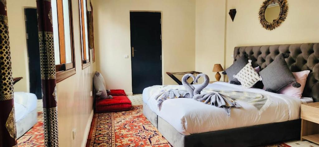 Postel nebo postele na pokoji v ubytování Riad Amazing