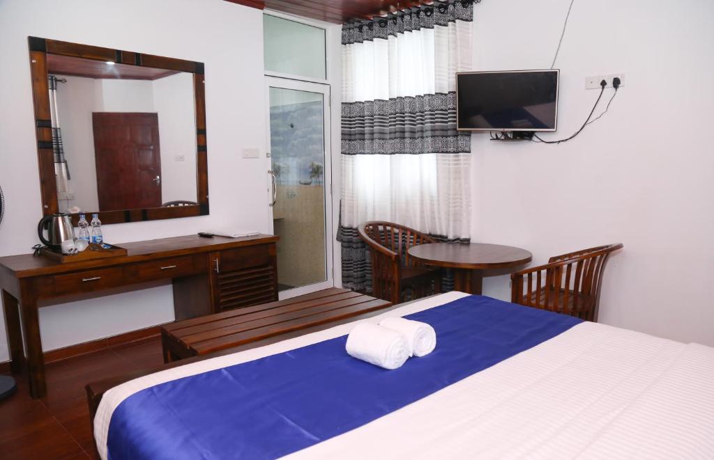 Postel nebo postele na pokoji v ubytování Hotel Sara