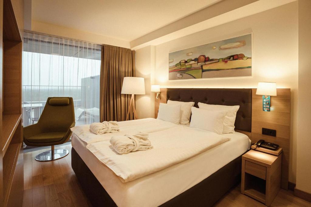מיטה או מיטות בחדר ב-Lielupe Hotel SPA & Conferences by Semarah